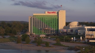 DX0002_172_019 - 5.7K aerial stock footage descend and orbit the hotel and casino at sunset in Council Bluffs, Iowa