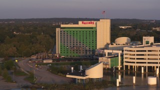 DX0002_172_021 - 5.7K aerial stock footage orbit the hotel and casino at sunset in Council Bluffs, Iowa