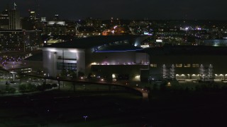 DX0002_173_025 - 5.7K stock footage aerial video orbit arena and convention center complex at night, Downtown Omaha, Nebraska