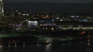 DX0002_173_026 - 5.7K aerial stock footage orbiting arena and convention center complex at night, Downtown Omaha, Nebraska