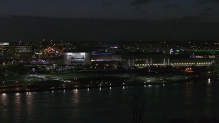 DX0002_173_027 - 5.7K aerial stock footage focus on arena and convention center complex at night during descent, Downtown Omaha, Nebraska