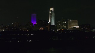 DX0002_173_054 - 5.7K stock footage aerial video of towering skyscrapers at night, Downtown Omaha, Nebraska