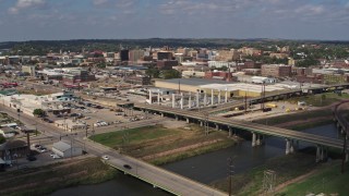 DX0002_174_001 - 5.7K aerial stock footage reverse view of riverfront warehouses near downtown, Sioux City, Iowa