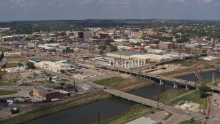 DX0002_174_004 - 5.7K stock footage aerial video approach bridges and riverfront warehouses near downtown, Sioux City, Iowa