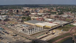 DX0002_174_005 - 5.7K aerial stock footage fly over bridges to approach riverfront warehouses near downtown, Sioux City, Iowa