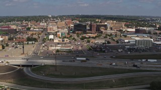 DX0002_174_013 - 5.7K aerial stock footage of office buildings and fast food restaurants seen from I-29 in Downtown Sioux City, Iowa