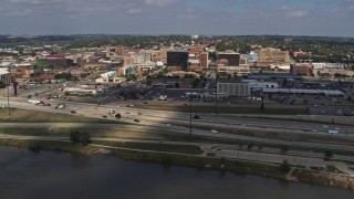 DX0002_174_014 - 5.7K stock footage aerial video of office buildings and I-29 seen from the river, Downtown Sioux City, Iowa