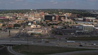 DX0002_174_017 - 5.7K aerial stock footage ascend over I-29 with a view of Downtown Sioux City, Iowa
