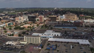 DX0002_174_023 - 5.7K aerial stock footage reverse view of office buildings in Downtown Sioux City, Iowa