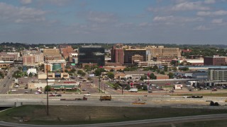 DX0002_174_026 - 5.7K aerial stock footage of office buildings and fast food restaurants by highway in Downtown Sioux City, Iowa
