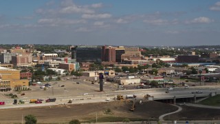 DX0002_174_027 - 5.7K aerial stock footage stationary view of office buildings and fast food restaurants by highway in Downtown Sioux City, Iowa