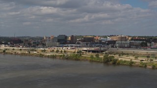 DX0002_174_031 - 5.7K aerial stock footage of office buildings in Downtown Sioux City, Iowa, descend by Missouri River