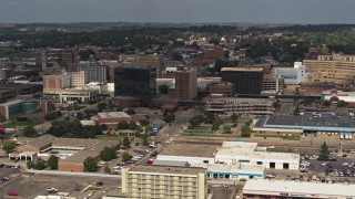 DX0002_174_034 - 5.7K stock footage aerial video slowly passing office buildings in Downtown Sioux City, Iowa