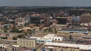 DX0002_174_035 - 5.7K aerial stock footage slowly flying by office buildings in Downtown Sioux City, Iowa