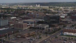 DX0002_175_005 - 5.7K aerial stock footage flying by Ho-Chunk Centre and nearby office buildings, Downtown Sioux City, Iowa