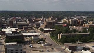 DX0002_175_015 - 5.7K aerial stock footage of a hospital and city buildings, Downtown Sioux City, Iowa