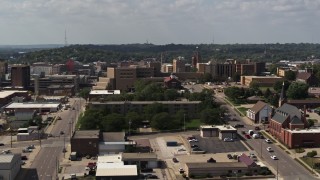 DX0002_175_017 - 5.7K aerial stock footage descend while focused on hospital, Downtown Sioux City, Iowa