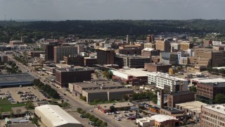 DX0002_175_021 - 5.7K stock footage aerial video flying by office buildings and the convention center, Downtown Sioux City, Iowa