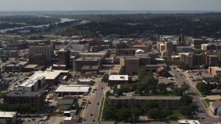 DX0002_175_024 - 5.7K aerial stock footage flying by 5th Street between office buildings and hospital, Downtown Sioux City, Iowa
