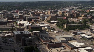 DX0002_175_030 - 5.7K stock footage aerial video passing the downtown area of the city, approach hospital, Downtown Sioux City, Iowa