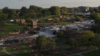 DX0002_176_001 - 5.7K aerial stock footage of the falls at Falls Park at sunset in Sioux Falls, South Dakota