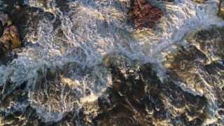DX0002_176_015 - 5.7K aerial stock footage a bird's eye view of the river at sunset in Sioux Falls, South Dakota