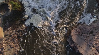 DX0002_176_018 - 5.7K aerial stock footage a bird's eye view of rapids at sunset in Sioux Falls, South Dakota