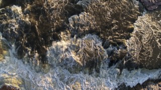 DX0002_176_019 - 5.7K aerial stock footage a bird's eye view of waterfalls at sunset in Sioux Falls, South Dakota