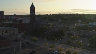 DX0002_176_022 - 5.7K aerial stock footage approach the Old Courthouse Museum at sunset in Downtown Sioux Falls, South Dakota