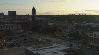 DX0002_176_023 - 5.7K aerial stock footage reverse view of the Old Courthouse Museum at sunset in Downtown Sioux Falls, South Dakota