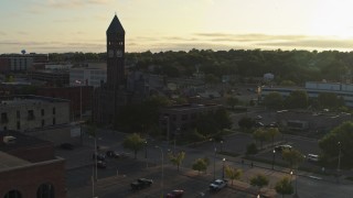 DX0002_176_025 - 5.7K aerial stock footage of flying toward the Old Courthouse Museum at sunset in Downtown Sioux Falls, South Dakota