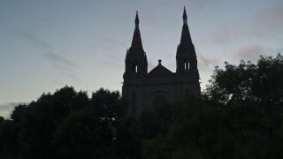 DX0002_176_032 - 5.7K aerial stock footage ascend and reveal the Cathedral of Saint Joseph at twilight in Sioux Falls, South Dakota