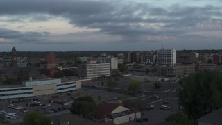 DX0002_176_034 - 5.7K aerial stock footage flyby and away from the city's downtown area at twilight, Downtown Sioux Falls, South Dakota