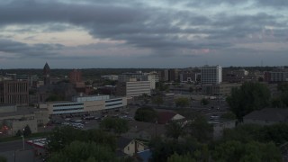 DX0002_176_035 - 5.7K aerial stock footage ofpassing by the city's downtown area at twilight, Downtown Sioux Falls, South Dakota