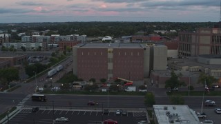 DX0002_176_041 - 5.7K aerial stock footage of a county government building at twilight, Downtown Sioux Falls, South Dakota
