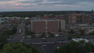 DX0002_176_042 - 5.7K aerial stock footage of an orbit of a county government building at twilight, Downtown Sioux Falls, South Dakota