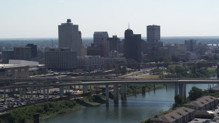 DX0002_177_004 - 5.7K aerial stock footage stationary view of the city's skyline and bridge before descent in Downtown Memphis, Tennessee