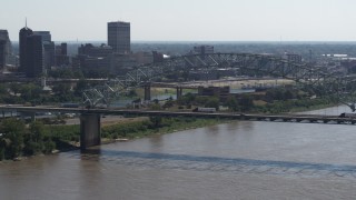 DX0002_177_016 - 5.7K aerial stock footage of slowly approach the bridge spanning the Mississippi River, Memphis, Tennessee