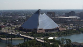 DX0002_177_019 - 5.7K aerial stock footage of a reverse view of the Memphis Pyramid in Downtown Memphis, Tennessee