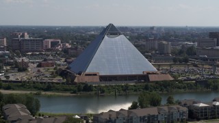 DX0002_177_020 - 5.7K aerial stock footage of an orbit of the Memphis Pyramid in Downtown Memphis, Tennessee