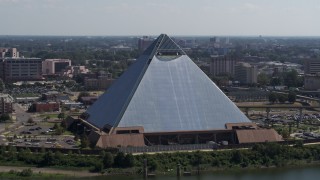 DX0002_177_021 - 5.7K aerial stock footage of orbiting the waterfront Memphis Pyramid in Downtown Memphis, Tennessee