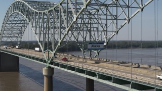 DX0002_177_023 - 5.7K aerial stock footage ascend from river, approach sign on the bridge, Memphis, Tennessee
