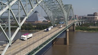 DX0002_177_027 - 5.7K aerial stock footage of cars crossing the bridge to Memphis, Tennessee