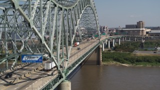 DX0002_177_028 - 5.7K aerial stock footage of following cars crossing the bridge to Memphis, Tennessee