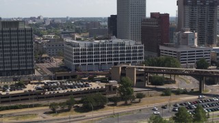 DX0002_177_032 - 5.7K aerial stock footage of approaching city hall in Downtown Memphis, Tennessee