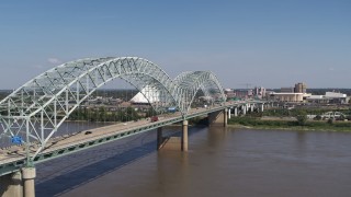 DX0002_178_026 - 5.7K aerial stock footage of an orbit of light traffic traveling on the bridge, Memphis, Tennessee