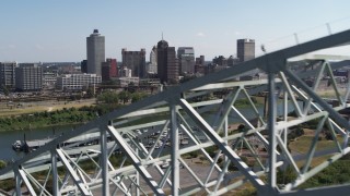 DX0002_178_035 - 5.7K aerial stock footage ascend past bridge for a view of the skyline of Downtown Memphis, Tennessee