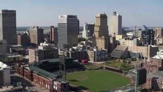 DX0002_179_001 - 5.7K stock footage aerial video of ascending toward tall office towers and baseball stadium in Downtown Memphis, Tennessee