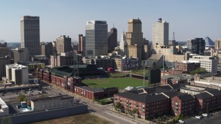 DX0002_179_004 - 5.7K stock footage aerial video descend with view of tall office towers and a baseball stadium in Downtown Memphis, Tennessee