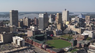 DX0002_179_005 - 5.7K stock footage aerial video descend with view of tall office towers and a baseball stadium in Downtown Memphis, Tennessee